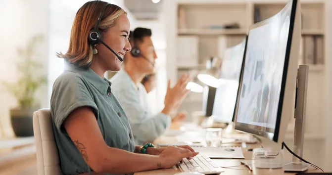 Smiling customer support representative wearing a headset, ready to help with VTX1 service questions